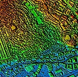 Aerial view of an urban area with height information conveyed by a spectrum of red, green and blue colours.