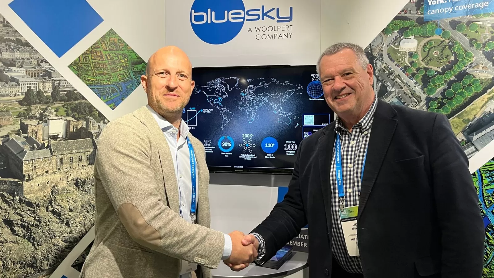 Image of Bluesky's Ralph Coleman shaking hands with Map Impact's Steve Keohane